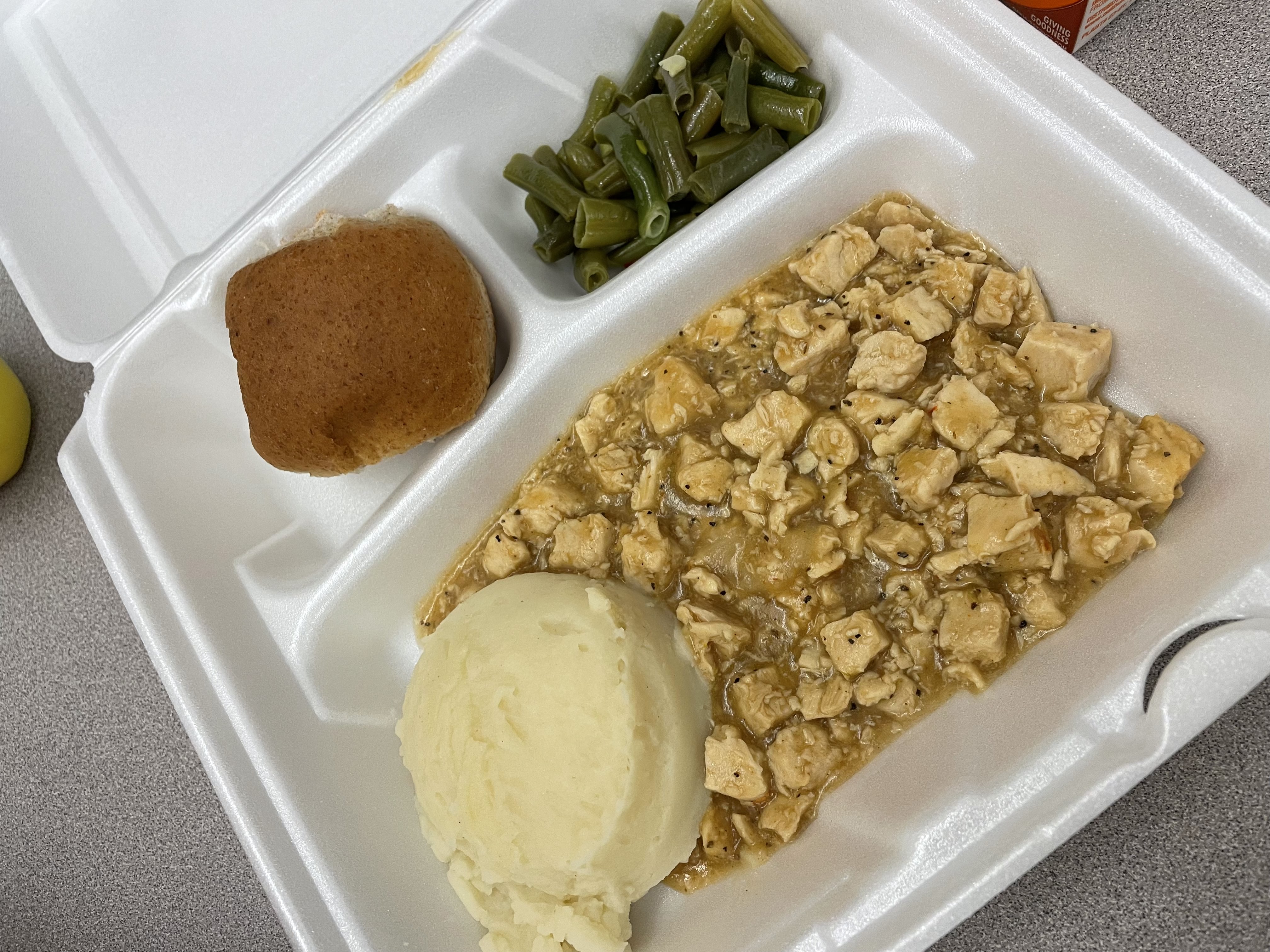 baby bird food with some apparently mashed potatoes and bread.